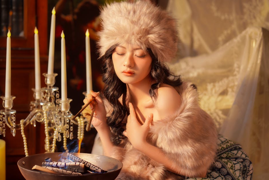 Elegant woman in fur hat by candlelight, evoking a vintage, luxurious atmosphere.