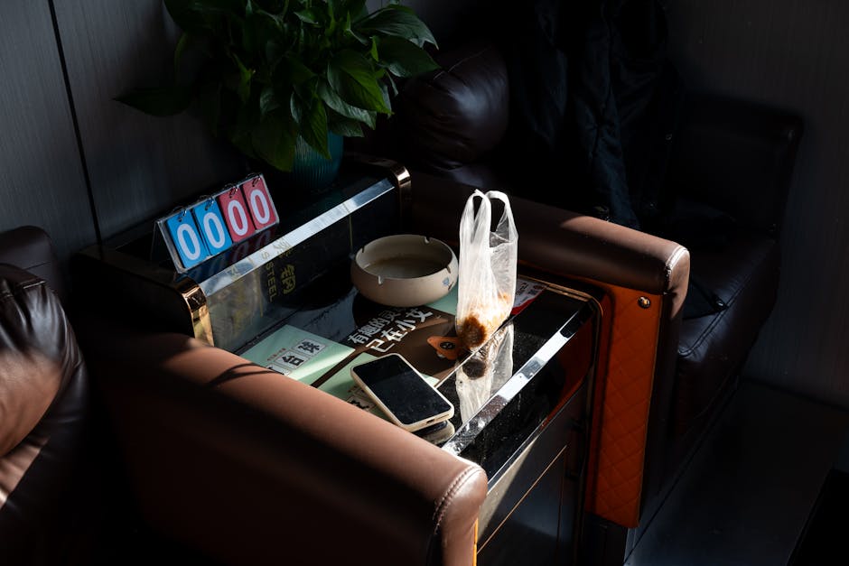 A relaxing lounge corner in Shanghai featuring snacks, a smartphone, and decorative plants.